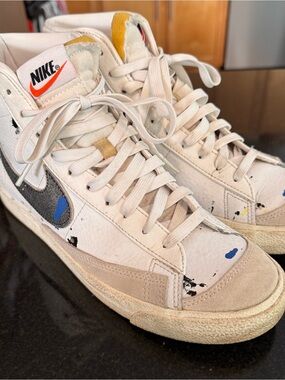 Nike White High-Top Sneakers with Blue, Black & Orange Accents